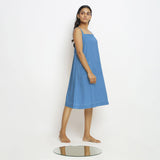 Right View of a Model wearing Powder Blue Vegetable Dyed Handspun Slip Dress