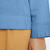 Close View of a Model wearing Vegetable-Dyed Blue 100% Cotton Straight Top