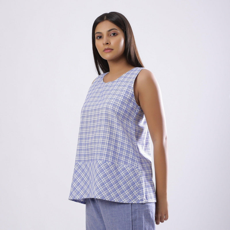 Left View of a Model wearing Powder Blue Handspun Checkered Top