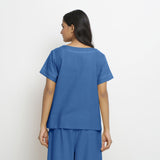 Back View of a Model wearing Blue Vegetable Dyed Paneled Top