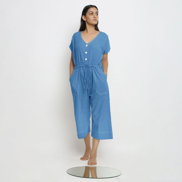 Front View of a Model wearing Powder Blue Vegetable Dyed Button-Down Jumpsuit