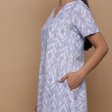 Left View of a Model wearing Handwoven Cotton Geometric Print Dress