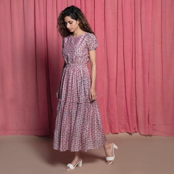 Left View of a Model wearing Powder Pink Chanderi Block Print Tier Peasant Dress