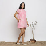 Right View of a Model wearing Powder Pink Checks Handspun Cotton Yoked Mini Dress