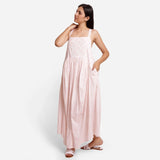 Front View of a Model wearing Powder Pink Cotton Block Print Gathered Maxi Dress