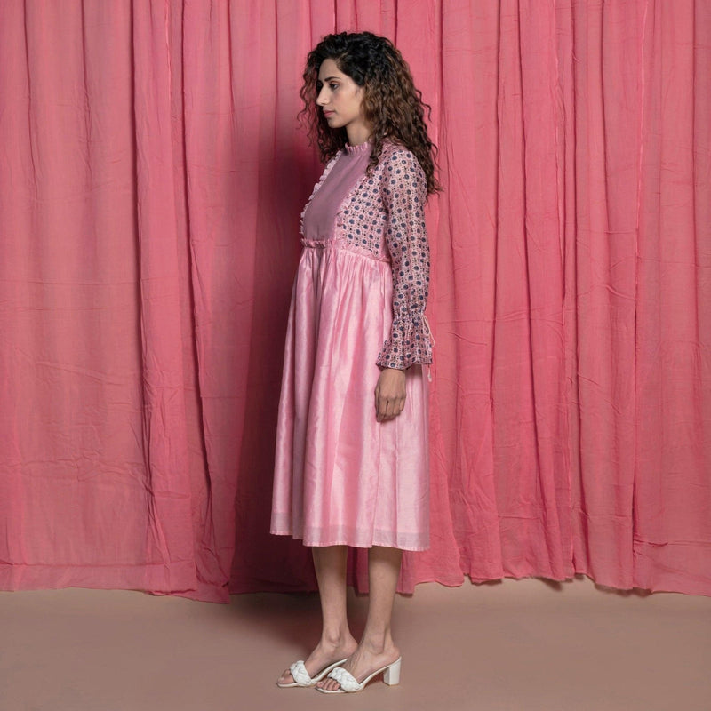 Left View of a Model wearing Powder Pink Chanderi Frilled Peasant Dress