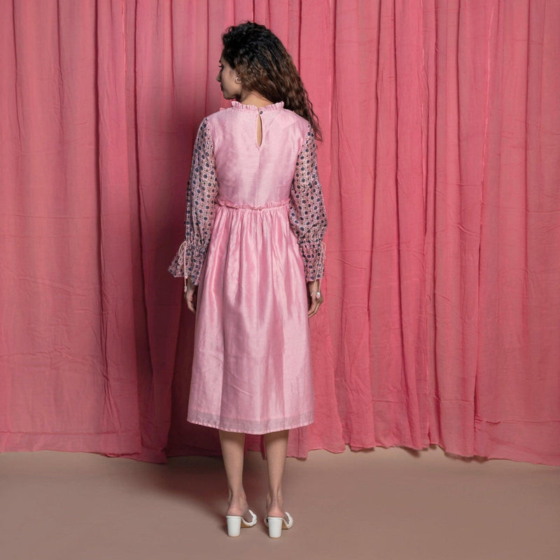 Right View of a Model wearing Powder Pink Chanderi Frilled Peasant Dress