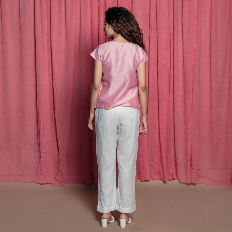 Back View of a Model wearing Powder Pink Cotton Chanderi Surplice Neck Top