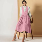 Front View of a Model wearing Powder Pink Cotton Flax Pinafore Midi Wrap Dress