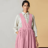 Front View of a Model wearing Powder Pink Cotton Flax Pinafore Midi Wrap Dress