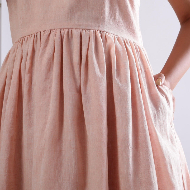 Close View of a Model wearing Powder Pink Handspun Camisole Dress