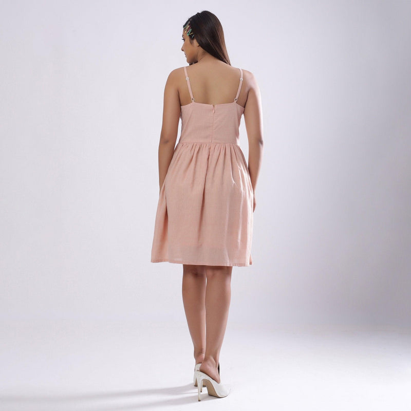 Back View of a Model wearing Powder Pink Handspun Camisole Dress