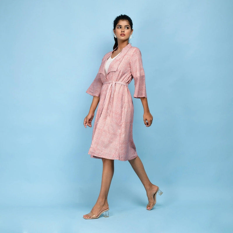 Left View of a Model wearing Powder Pink Block Printed 100% Cotton Knee-Length Overlay