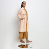 Right View of a Model wearing Powder Pink Vegetable Dyed Handspun Cotton Notched Collar Front Open Overlay