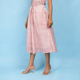 Left View of a Model wearing Powder Pink Block Printed 100% Cotton A-Line Skirt