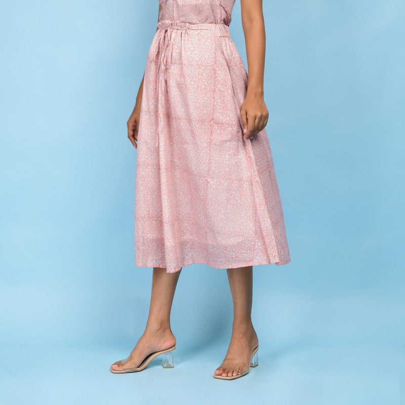 Left View of a Model wearing Powder Pink Block Printed 100% Cotton A-Line Skirt