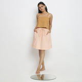 Front View of a Model wearing Vegetable Dyed Powder Pink Mid Rise Skirt