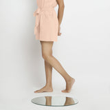 Left View of a Model wearing Powder Pink Vegetable Dyed Handspun Short Shorts