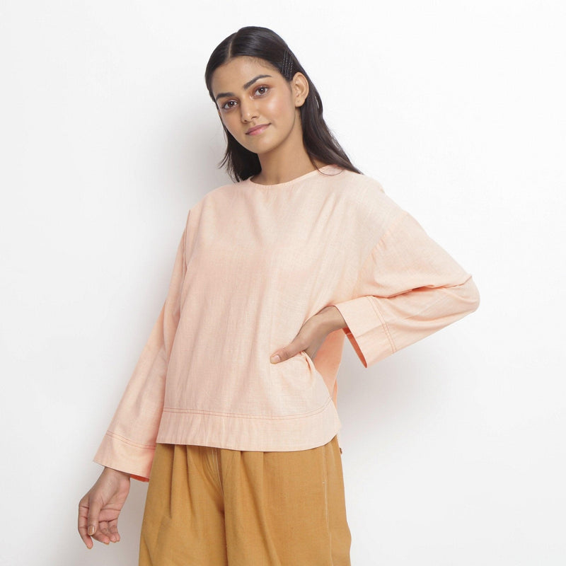 Front View of a Model wearing Powder Pink Vegetable Dyed Straight Fit Top