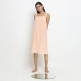 Front View of a Model wearing Powder Pink Vegetable Dyed Handspun Slip Dress