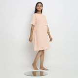 Right View of a Model wearing Powder Pink Handspun Vegetable Dyed Yoked Dress