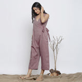 Left View of a Model wearing Purple Handspun Plunge Neck Wrap Jumpsuit