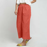 Left View of a Model wearing Red Wide Legged Straight Pant