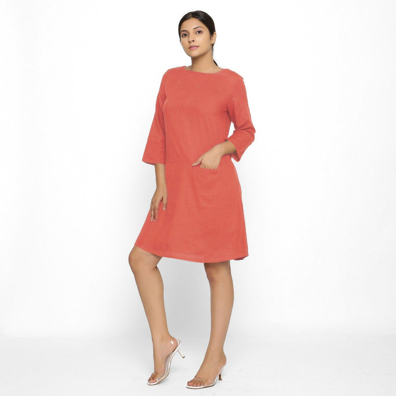 Front View of a Model wearing Red Yoked Cotton Tunic Dress