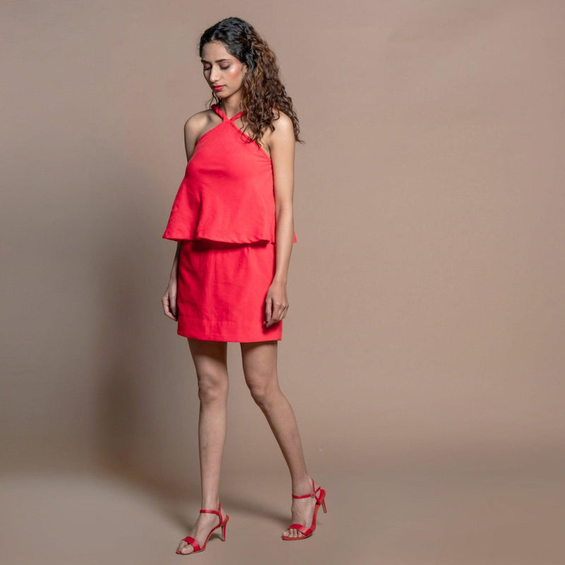 Left View of a Model wearing Red Cotton Velvet Halter Neck Flared Top