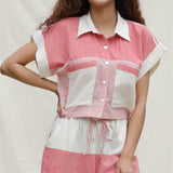 Front Detail of a Model wearing Red and Beige Striped 100% Cotton Button-Down Cropped Shirt