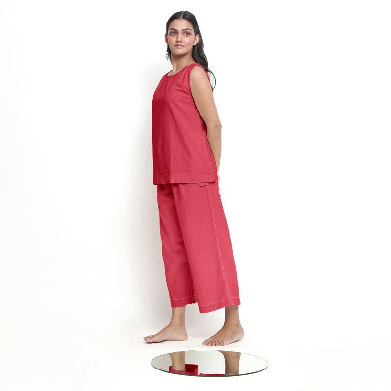 Left View of a Model wearing Red A-Line Top and Brick Red Pant Set