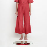 Front View of a Model wearing Brick Red Vegetable Dyed 100% Cotton Wide Legged Pant