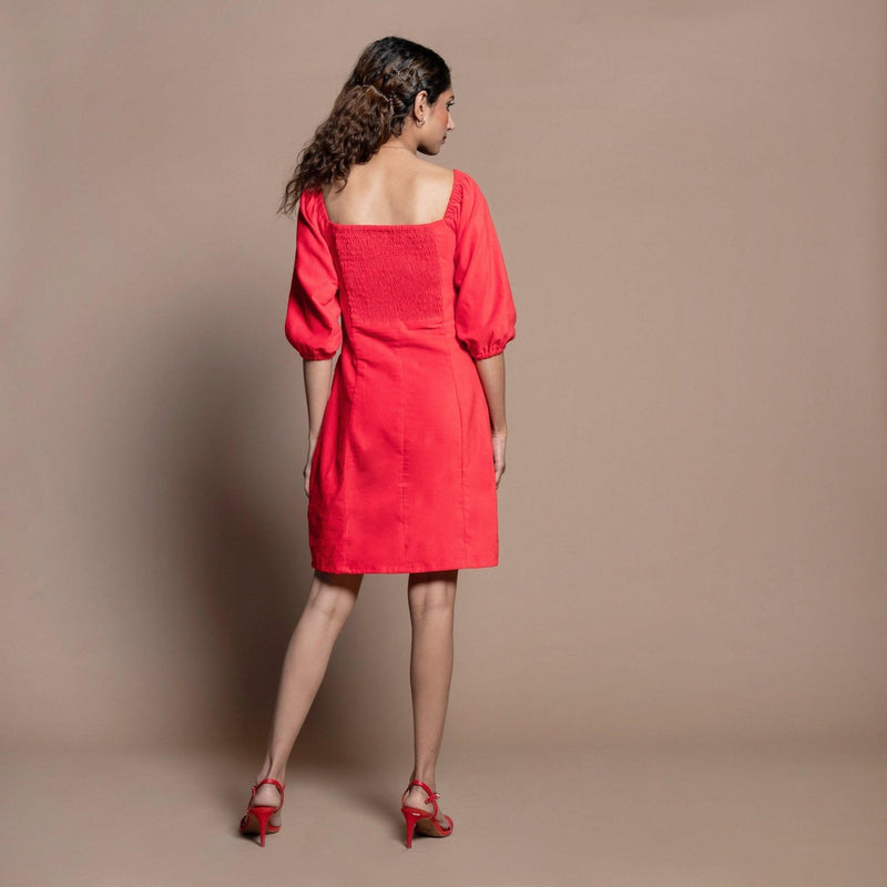 Back View of a Model wearing Red Cotton Velvet Sweetheart Neck Short Paneled Dress