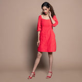 Front View of a Model wearing Red Cotton Velvet Sweetheart Neck Short Paneled Dress