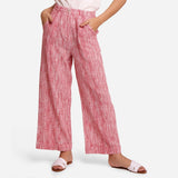 Front View of a Model wearing Red Crinkled Cotton Ankle Length Pant