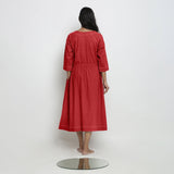 Back View of a Model wearing Vegetable-Dyed Red 100% Cotton Button-Down Dress