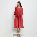 Front View of a Model wearing Vegetable-Dyed Red 100% Cotton Button-Down Dress