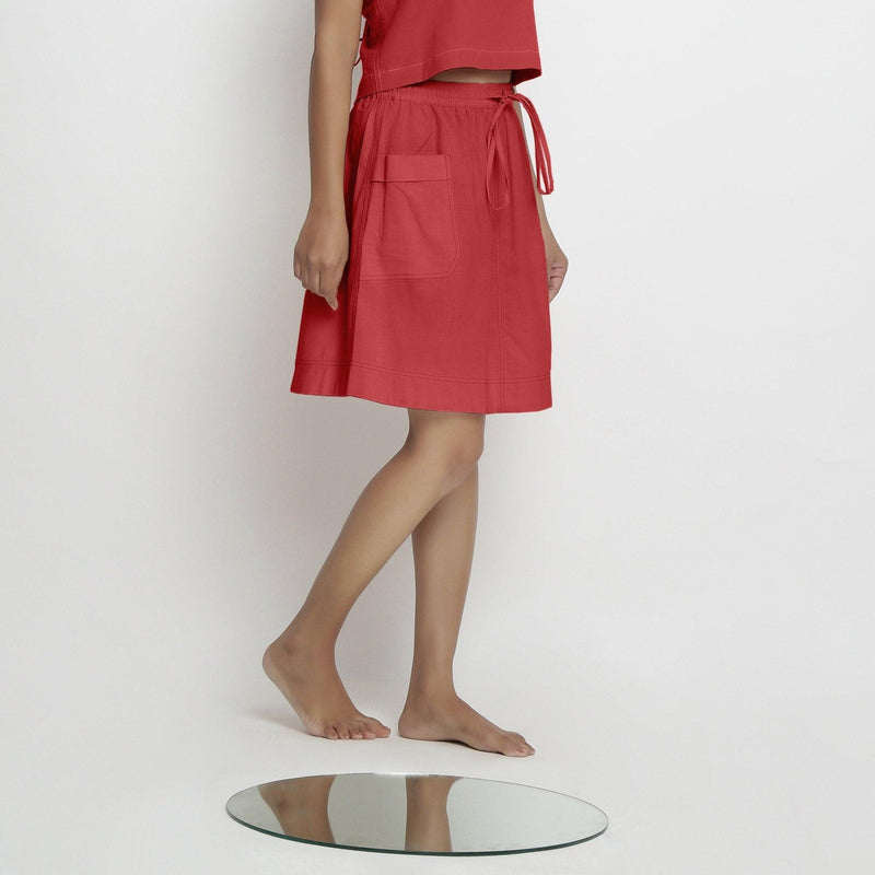 Right View of a Model wearing Vegetable-Dyed Red 100% Cotton Mid-Rise Skirt