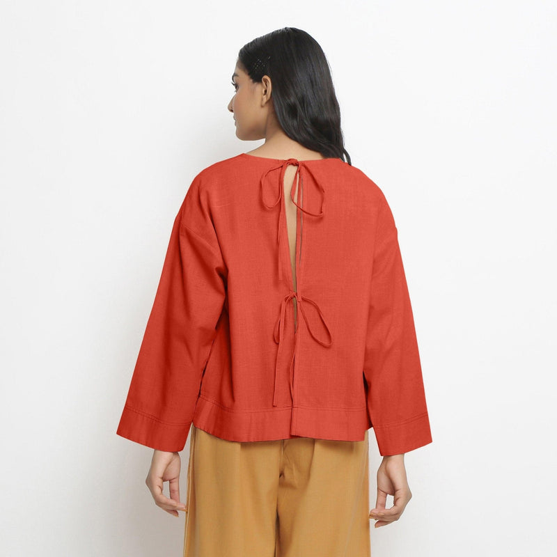 Back View of a Model wearing Vegetable-Dyed Red 100% Cotton Straight Top