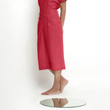 Left View of a Model wearing Mid-Rise Vegetable Dyed Red Cotton Culottes