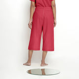 Back View of a Model wearing Mid-Rise Vegetable Dyed Red Cotton Culottes