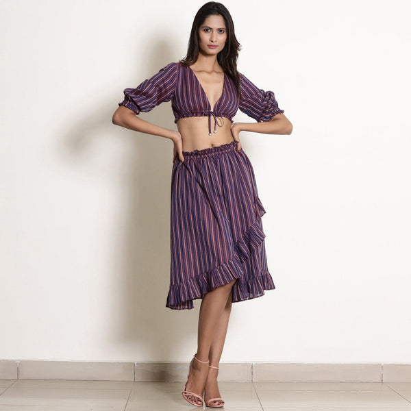Front View of a Model wearing Reversible Plunge Neck Top and Wrap Skirt Set