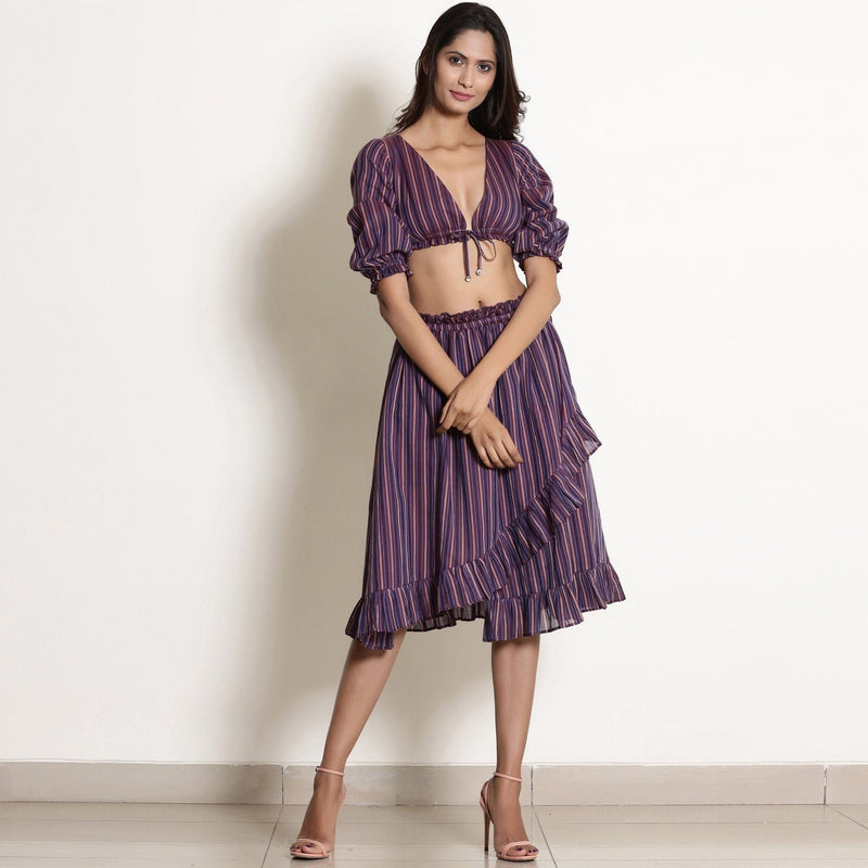 Front View of a Model wearing Reversible Plunge Neck Top and Wrap Skirt Set