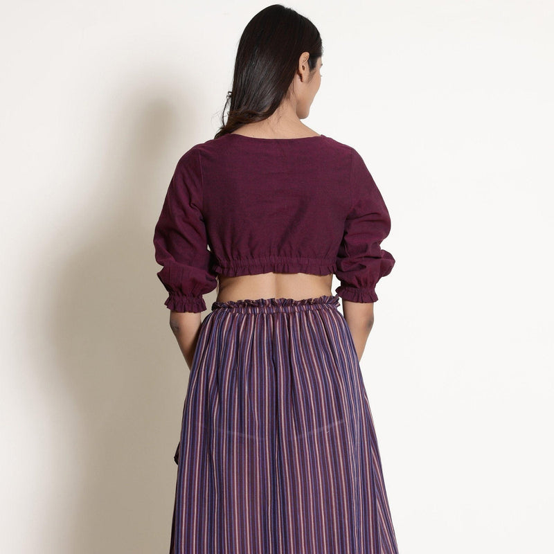Back View of a Model wearing Reversible Plunge Neck Top and Wrap Skirt Set