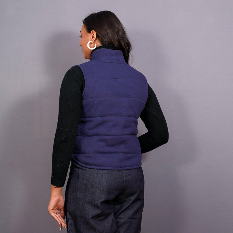 Back View of a Model wearing Reversible Blue and Red Warm Cotton Waffle Sleeveless Quilted Puffer Jacket