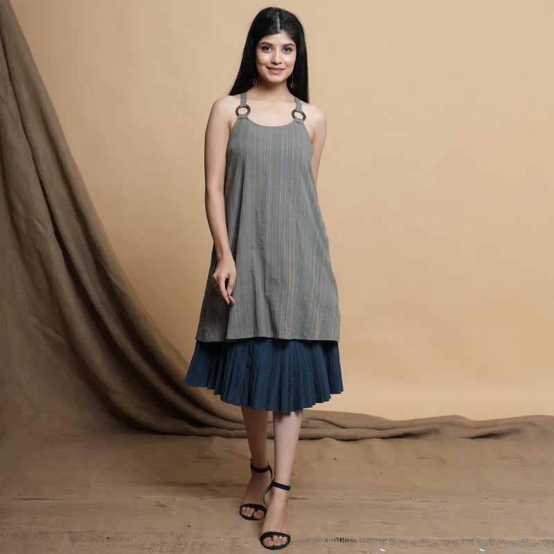 Front View of a Model wearing Reversible Pleated Knee Length Dress