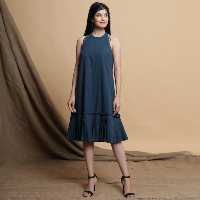 Front View of a Model wearing Reversible Pleated Knee Length Dress