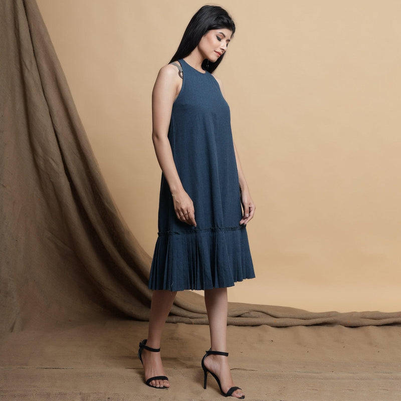 Right View of a Model wearing Reversible Pleated Knee Length Dress