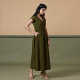 Right View of a Model wearing Reversible Moss Green Tie-Dye Cotton Maxi Wrap Dress