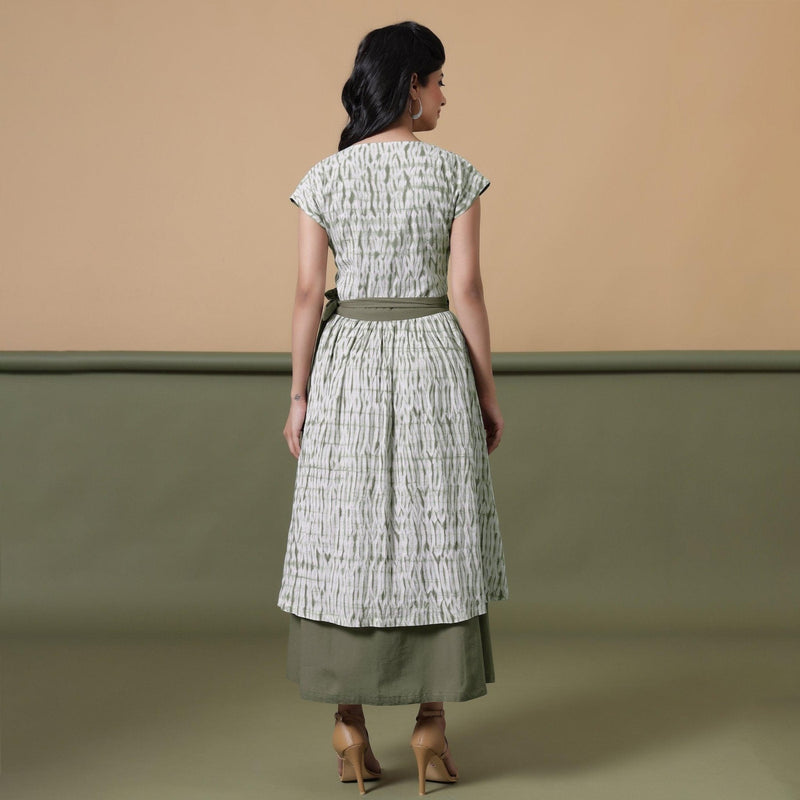 Back View of a Model wearing Reversible Shibori Green Wrap Dress